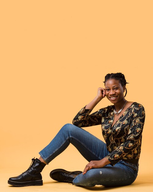 Cheerful afroamerican model sitting