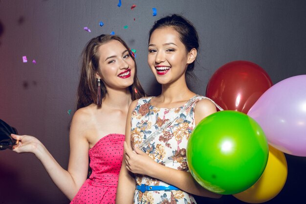 Cheerful beautiful young women having party