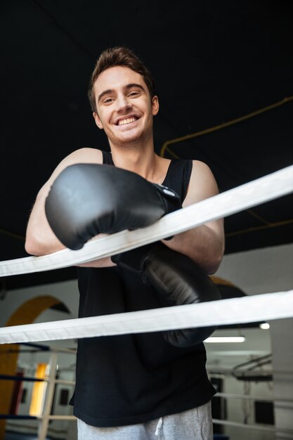 Cheerful boxer looking at camera