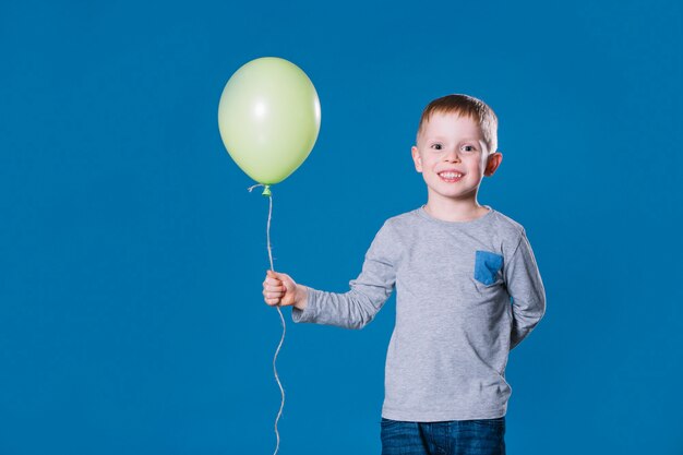 Cheerful boy with balloon