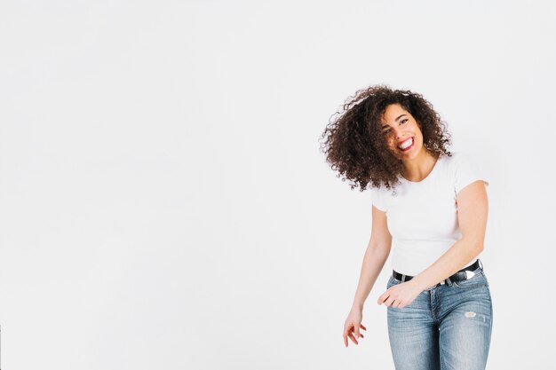 Free photo cheerful brunette looking at camera on white