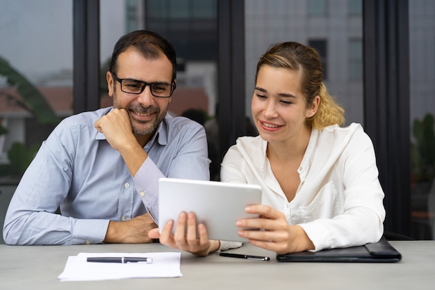 Cheerful business colleagues having video chat