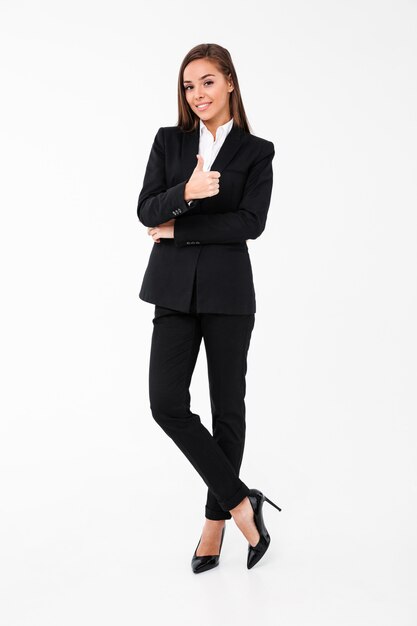 Cheerful business woman showing thumbs up