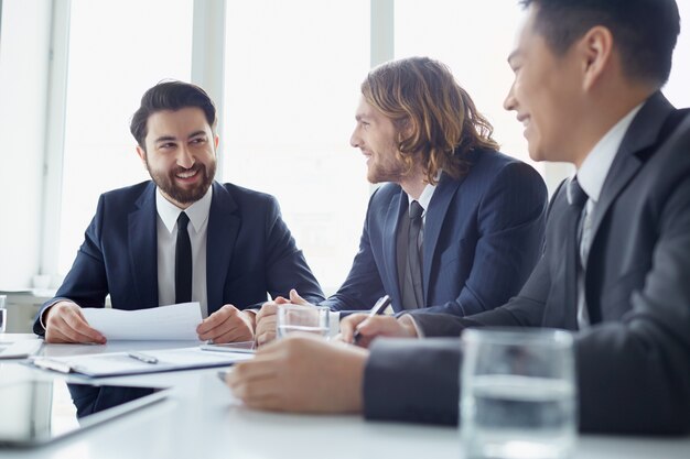 Cheerful businesspeople negotiating