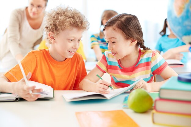 Cheerful classmates chatting