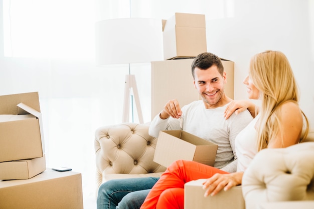 Cheerful couple with boxes