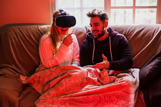 Cheerful couple with VR headset