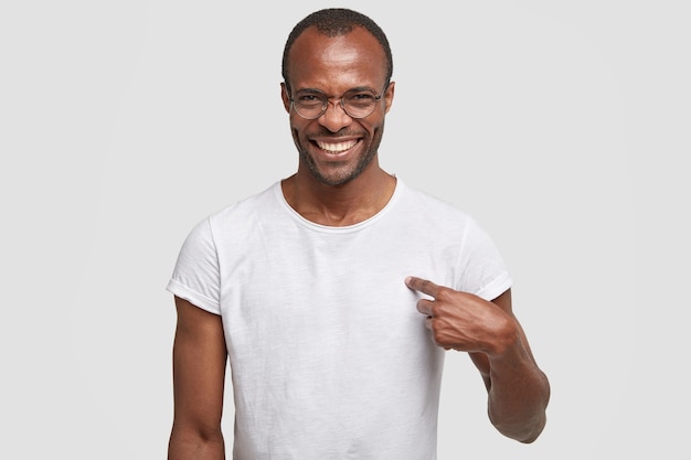 Cheerful dark skinned guy with toothy smile