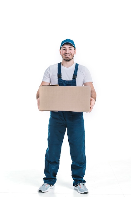 Cheerful deliveryman with parcel