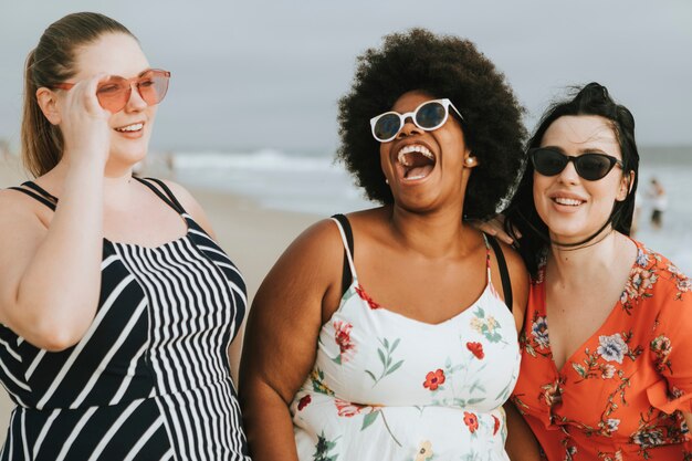 Cheerful diverse plus size women at the beach