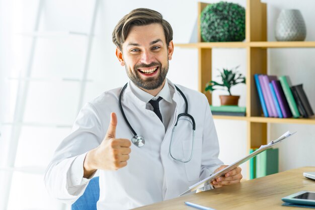 Cheerful doctor gesturing thumb-up