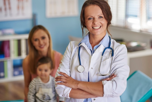 Cheerful doctor and her patients