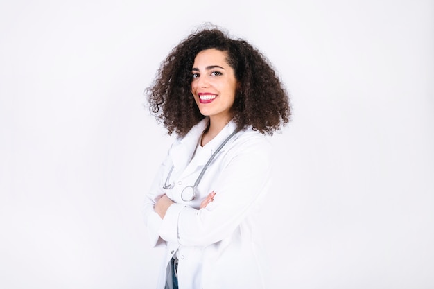 Free photo cheerful doctor with curly hair