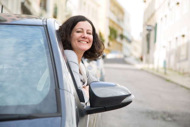 Cheerful driving school student successfully passing exam