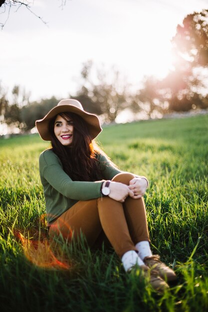 Cheerful elegant model laughing on meadow