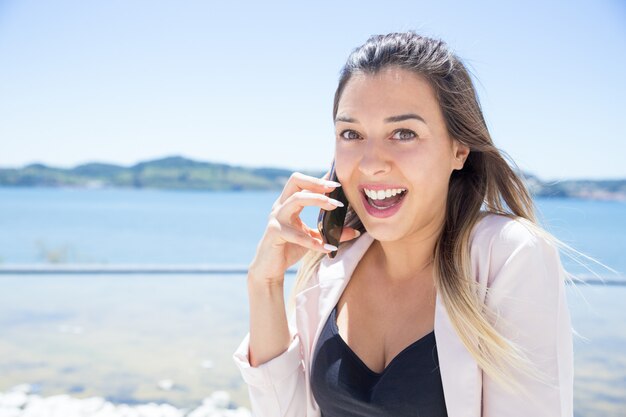 Cheerful excited lady happy to get great news