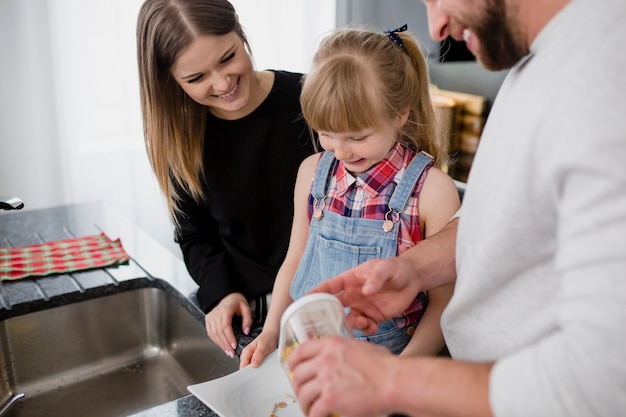 Cheerful family cooking breakfast