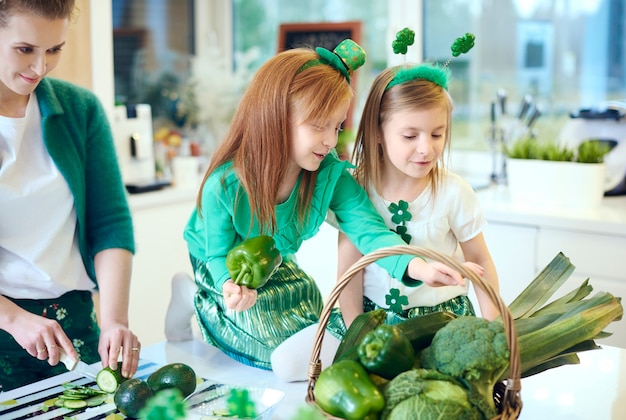 Cheerful family cooking at kitchen