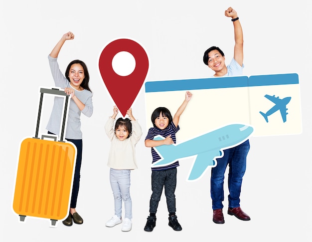 Free Photo cheerful family holding travel icons and ticket