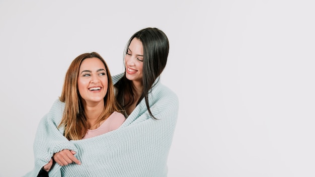 Cheerful female alternative couple in plaid