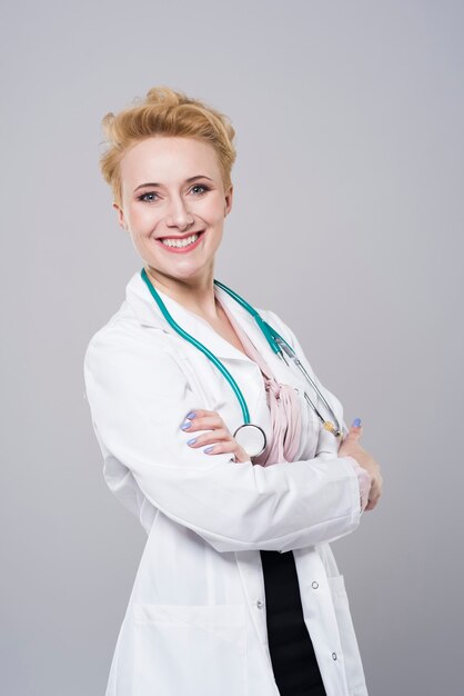 Cheerful female doctor with stethoscope