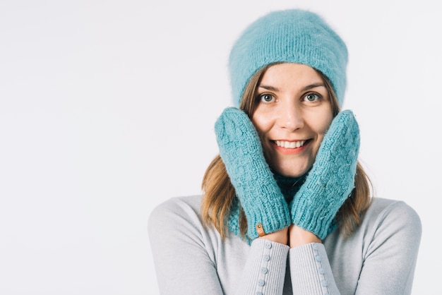 Cheerful female in hat and mittens