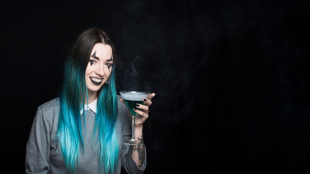 Cheerful female with smoky beverage