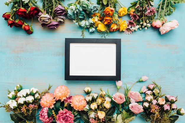 Free photo cheerful flowers with frame.