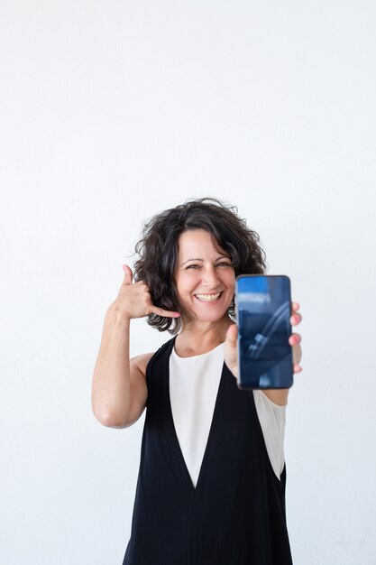 Cheerful friendly woman advertising mobile data plan