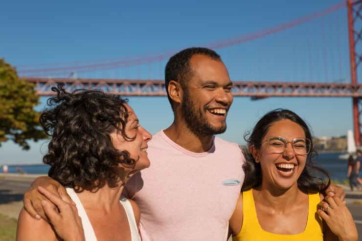 Free Photo cheerful friends embracing outdoors