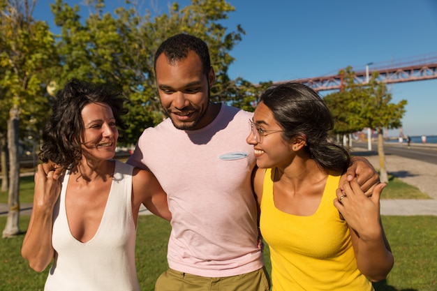 Cheerful friends laughing in park