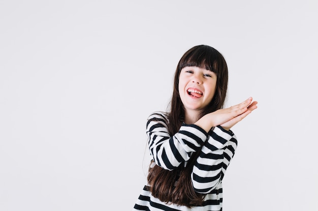 Cheerful girl clapping hands