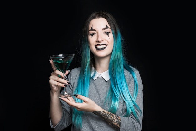 Cheerful girl holding wineglass