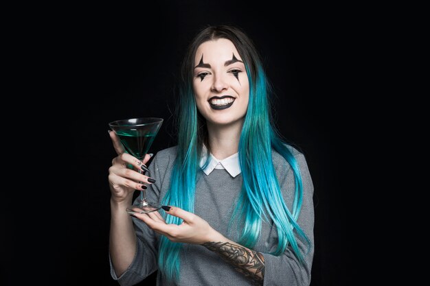 Cheerful girl holding wineglass