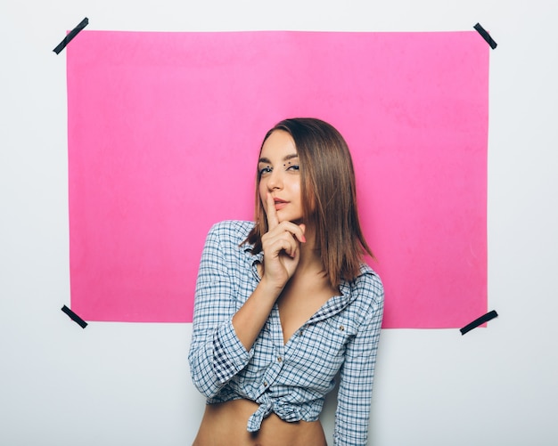 Cheerful girl posing at camera