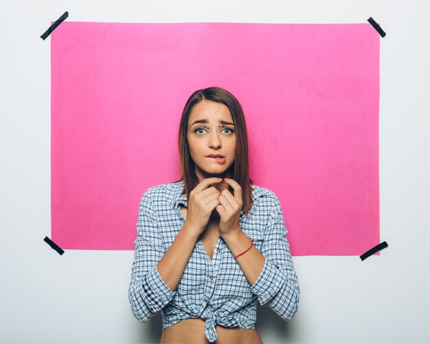 Cheerful girl posing at camera