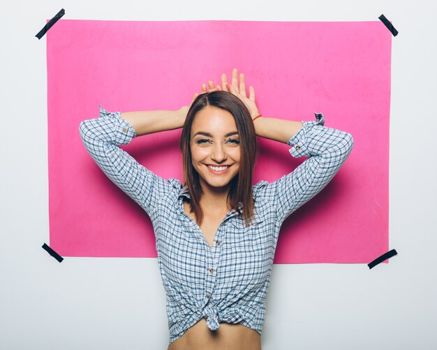 Cheerful girl posing at camera