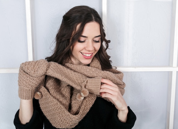 Cheerful girl pulling off a glove