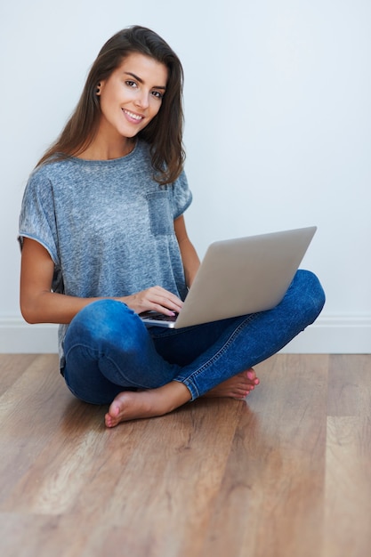 Cheerful girl surfing the Internet