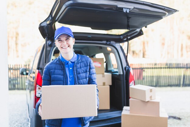 Cheerful girl with carton boxes