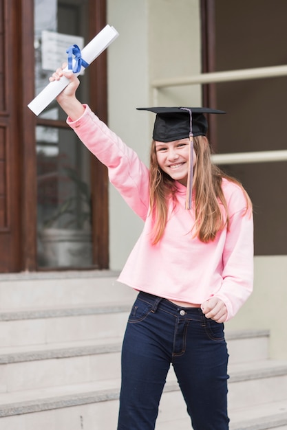 Cheerful girl with diploma