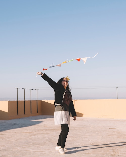 Free photo cheerful girl with flag garland