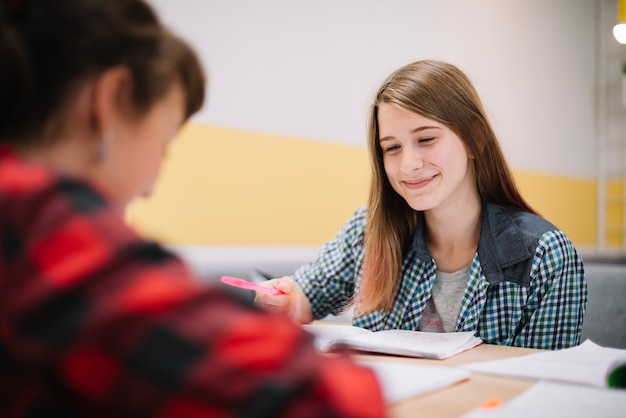 Free photo cheerful girls with books