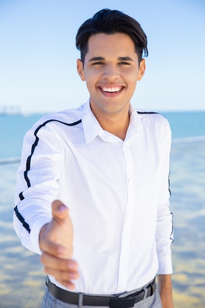 Cheerful guy posing outdoors