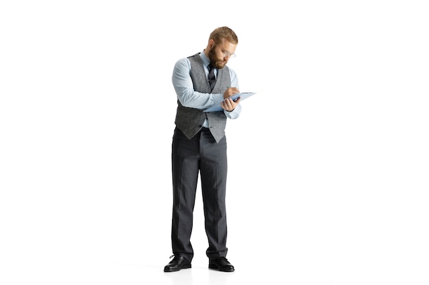 Cheerful handsome businessman isolated over white studio surface