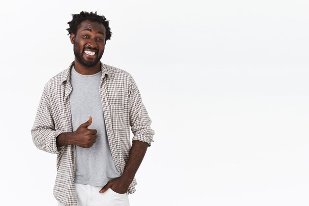 Cheerful, happy carefree attractive african-american man with beard
