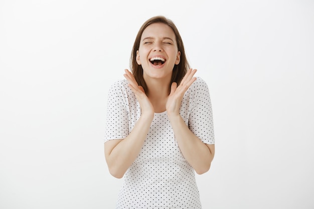 Cheerful happy woman celebrating great news, clap hands and laughing in rejoice