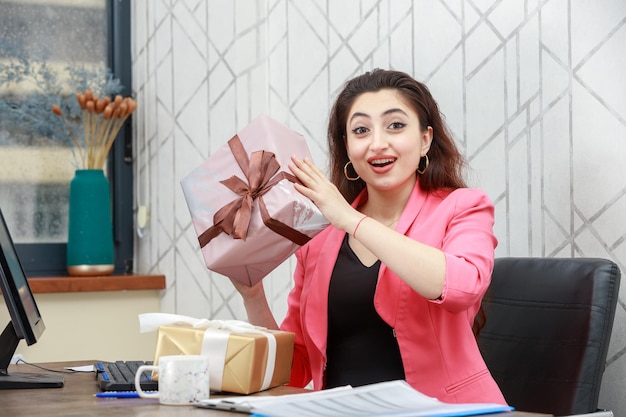 Cheerful lady is very happy because of present