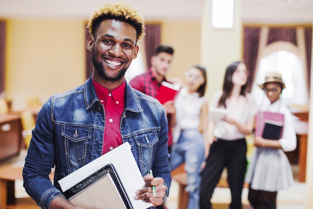 Cheerful man in classroom posing at camera