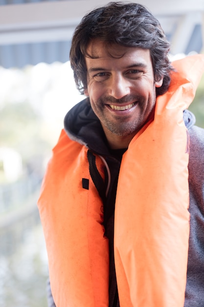 Free photo cheerful man ready to boating trip